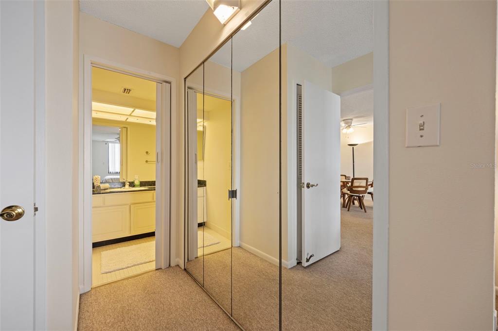9425 Blind Pass Road, Unit 1006 St. Pete Beach, FL 33706 - Photo 21 of 45 a bathroom with a shower and a sink