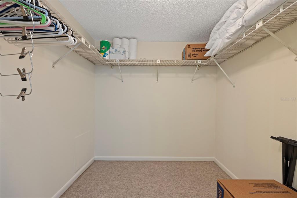 9425 Blind Pass Road, Unit 1006 St. Pete Beach, FL 33706 - Photo 25 of 45 a view of small space with racks on the wall