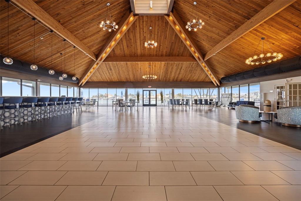 9425 Blind Pass Road, Unit 1006 St. Pete Beach, FL 33706 - Photo 32 of 45 a view of a room with lots of wooden furniture