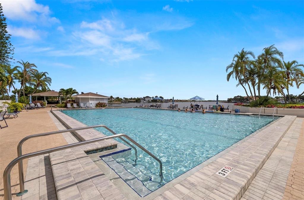 9425 Blind Pass Road, Unit 1006 St. Pete Beach, FL 33706 - Photo 35 of 45 a view of a backyard
