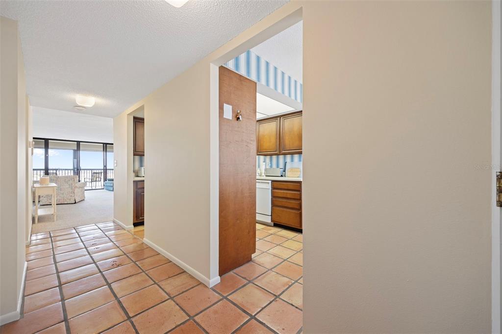 9425 Blind Pass Road, Unit 1006 St. Pete Beach, FL 33706 - Photo 4 of 45 a view of a hallway