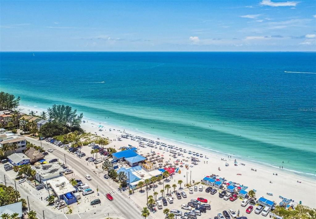 9425 Blind Pass Road, Unit 1006 St. Pete Beach, FL 33706 - Photo 44 of 45 a view of an ocean from a balcony