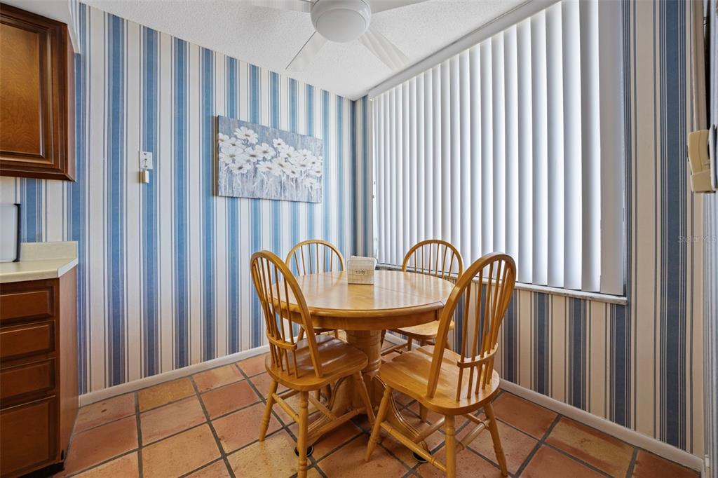 9425 Blind Pass Road, Unit 1006 St. Pete Beach, FL 33706 - Photo 6 of 45 a view of a chair and table in a balcony