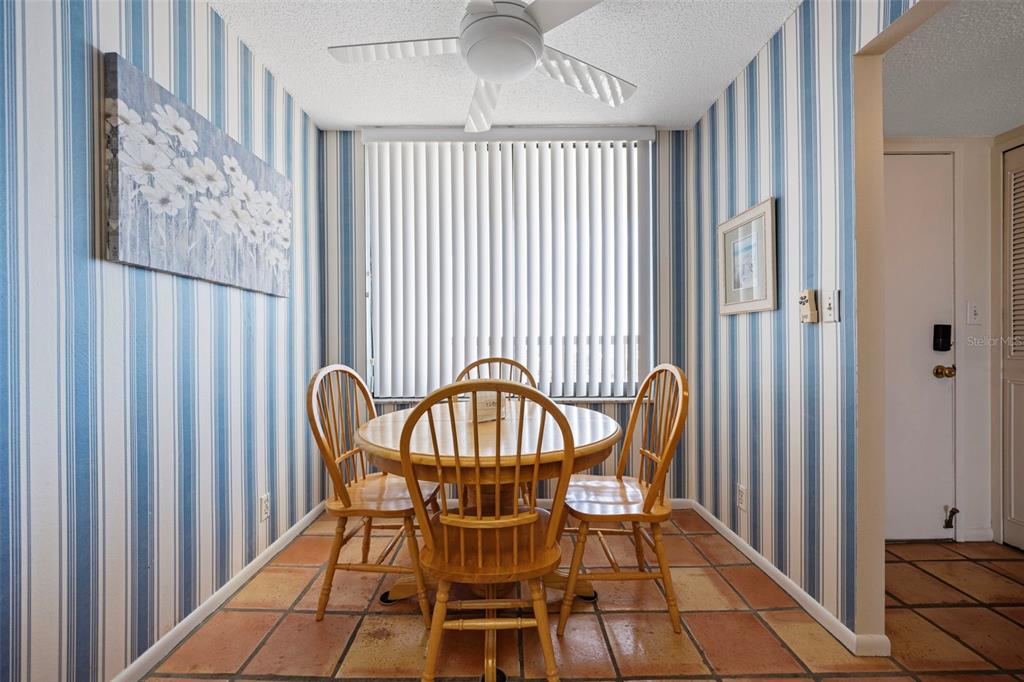 9425 Blind Pass Road, Unit 1006 St. Pete Beach, FL 33706 - Photo 7 of 45 a view of a chair and table in the balcony