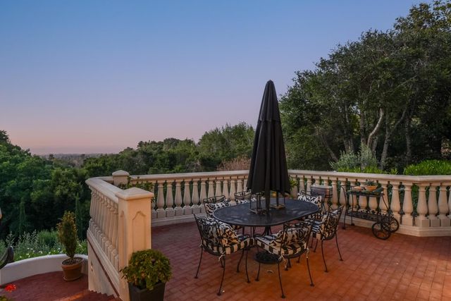 a view of a table and chairs in the roof deck