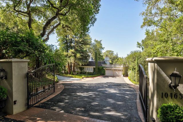 a view of a patio with table and chairs and potted plants