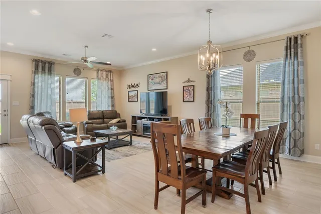 a spacious bedroom with a bed and a large window