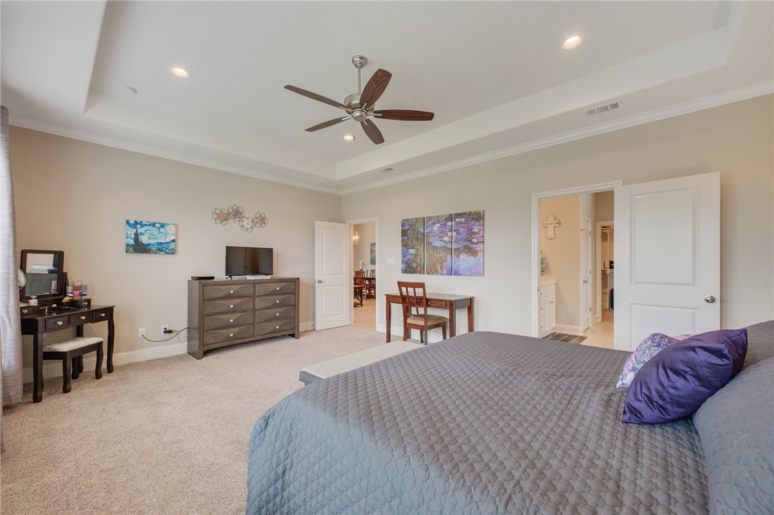 4261 Harding Way Bryan, TX 77802 - Photo 13 of 27 a bed room with a bed and a television