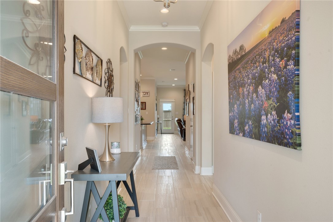 4261 Harding Way Bryan, TX 77802 - Photo 2 of 27 a view of a hallway with wooden floor and staircase