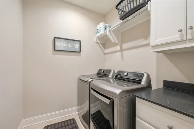 a view of a hallway with closet and a fireplace