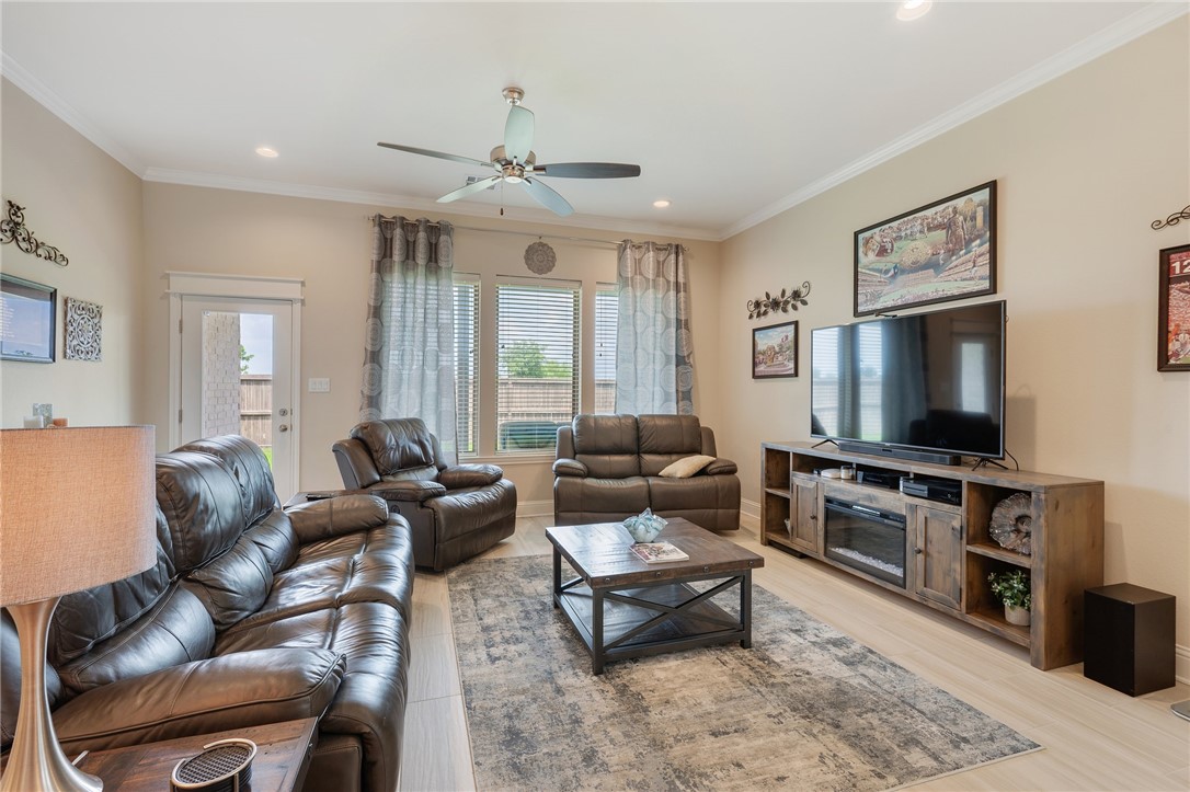 4261 Harding Way Bryan, TX 77802 - Photo 7 of 27 a living room with furniture and a flat screen tv