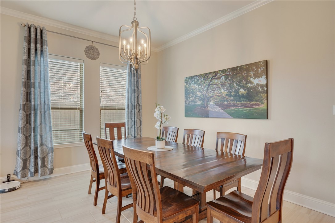 4261 Harding Way Bryan, TX 77802 - Photo 10 of 27 a view of a dining room with furniture window and outside view