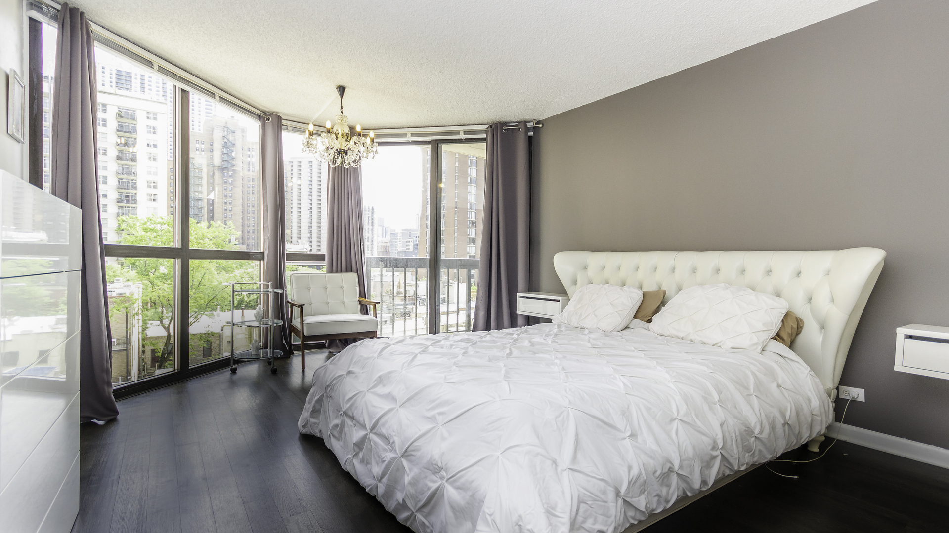 33 West Delaware Place, Unit 7A Chicago, IL 60610 - Photo 12 of 35 a bed sitting in a bedroom next to a large window