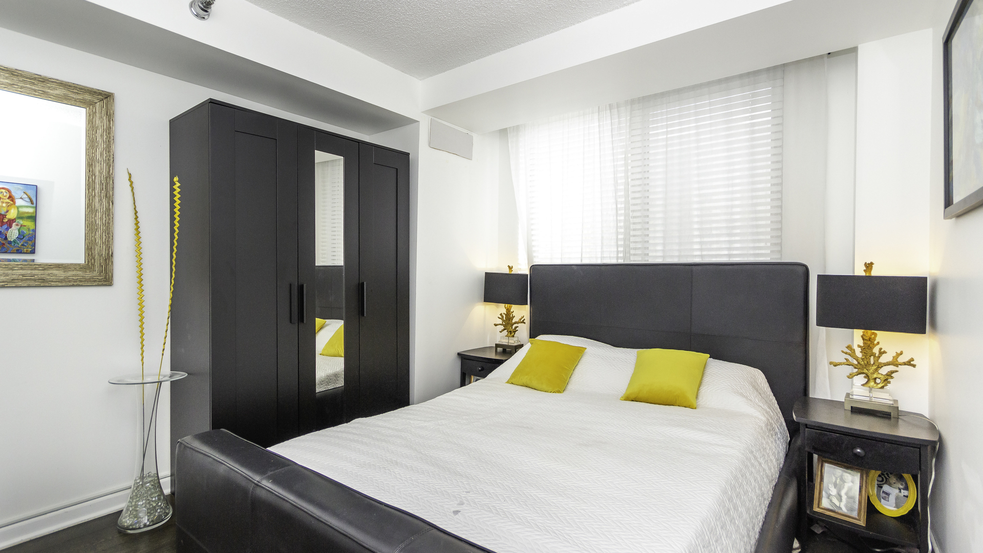 33 West Delaware Place, Unit 7A Chicago, IL 60610 - Photo 17 of 35 a bedroom with a bed and a tv on dresser