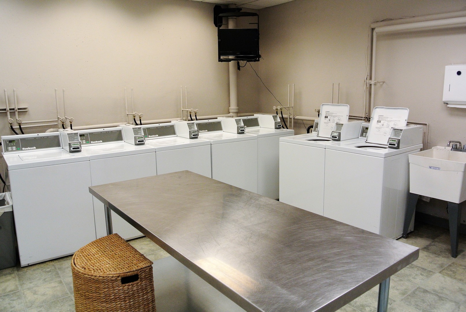 33 West Delaware Place, Unit 7A Chicago, IL 60610 - Photo 24 of 35 a kitchen with a sink cabinets and wooden floor
