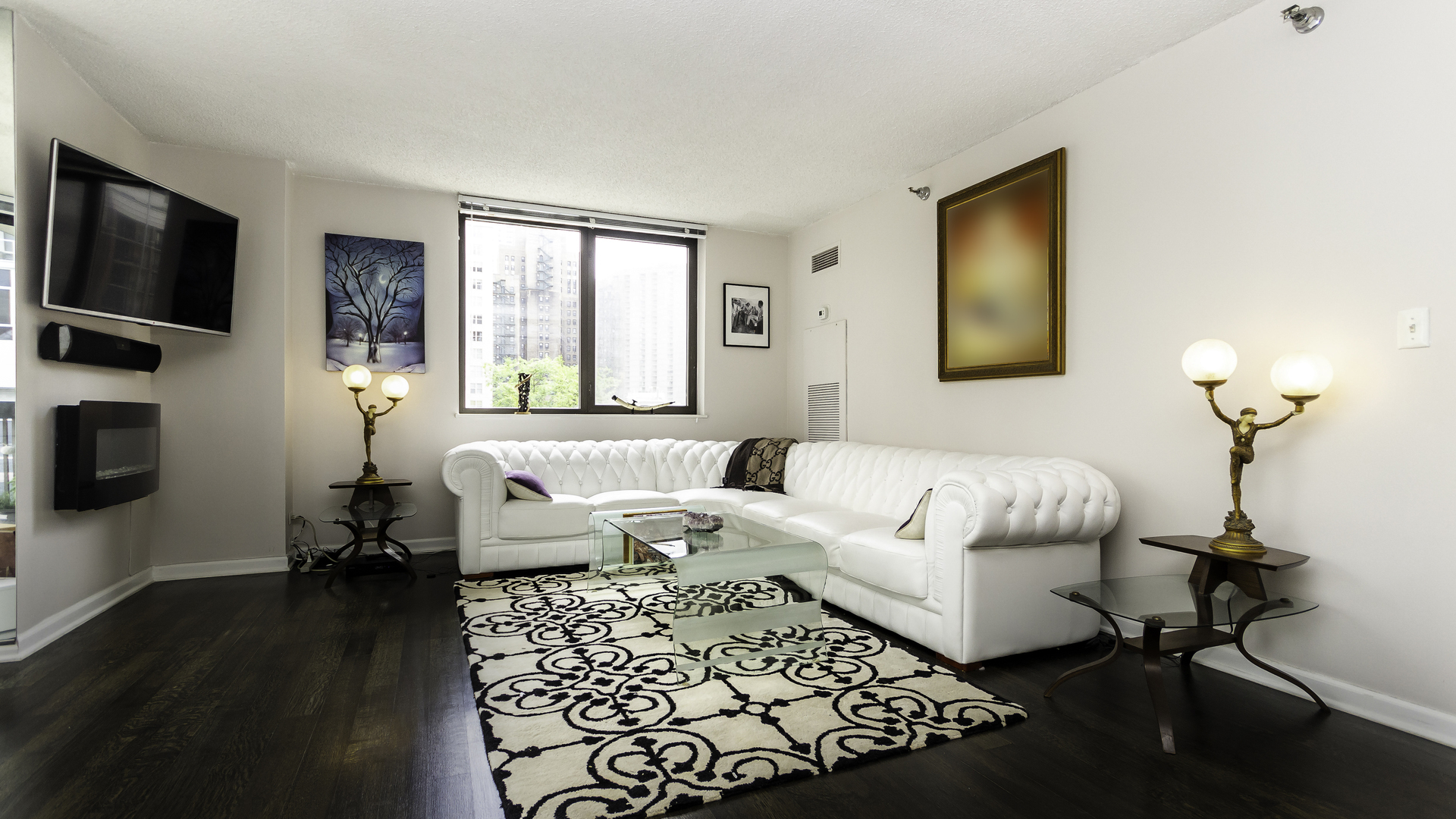 33 West Delaware Place, Unit 7A Chicago, IL 60610 - Photo 6 of 35 a living room with furniture a flat screen tv and a window