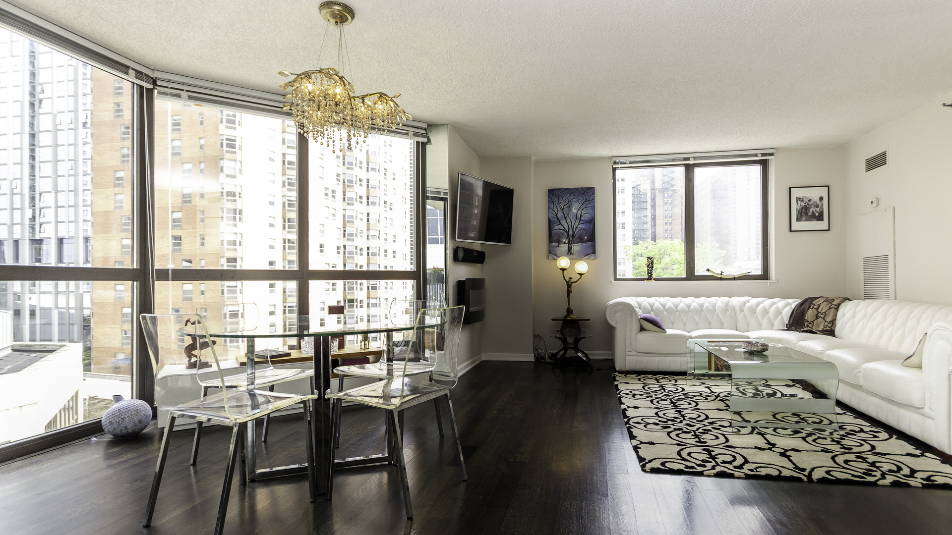 33 West Delaware Place, Unit 7A Chicago, IL 60610 - Photo 7 of 35 a living room with furniture and a large window