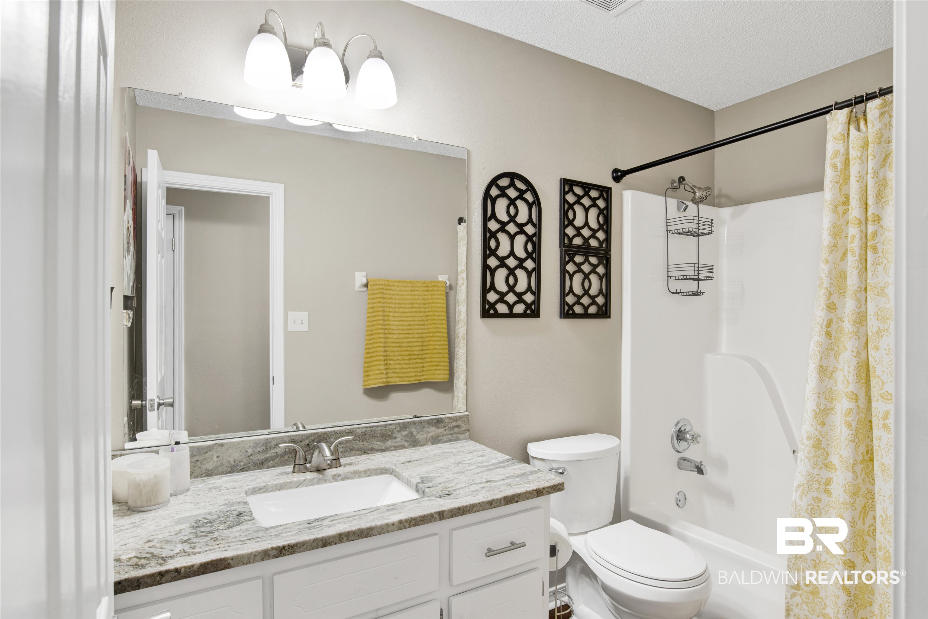 6281 Woodside Drive Theodore, AL 36582 - Photo 15 of 17 Full bath featuring vanity, shower / tub combo, and a textured ceiling