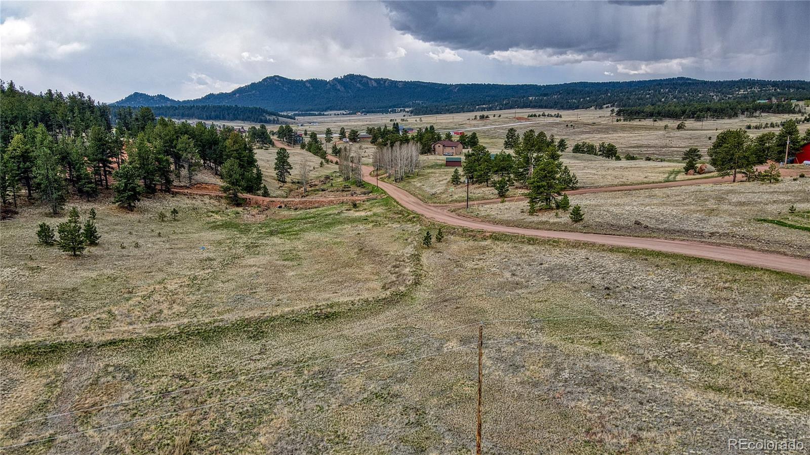 188 High Pasture Road Florissant, CO 80816 - Photo 5 of 18 a view of a lake with a mountain in the background