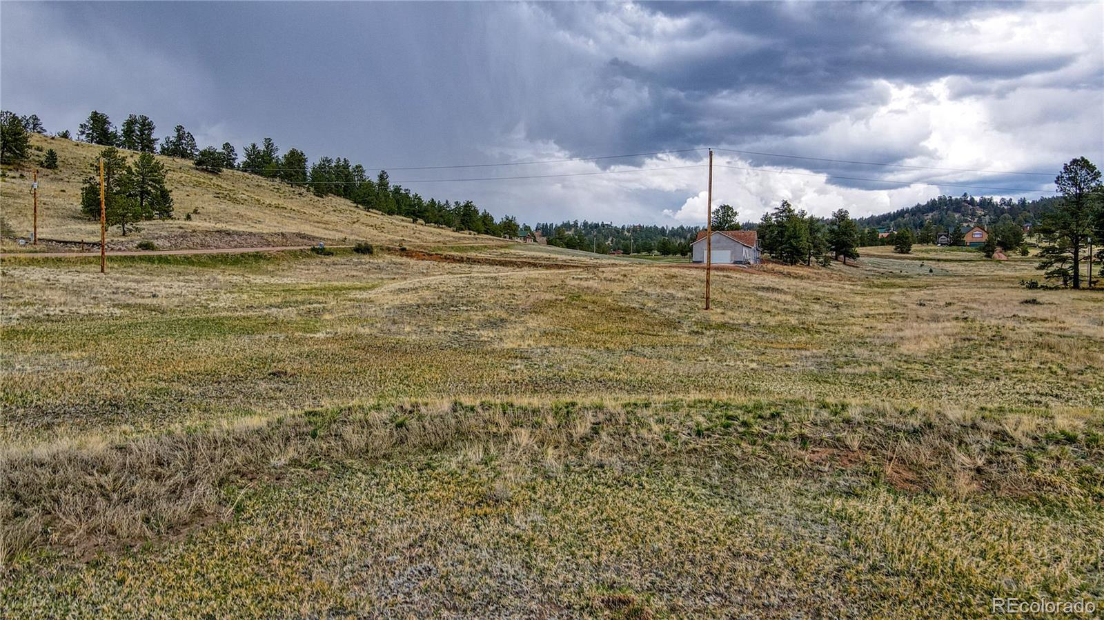 188 High Pasture Road Florissant, CO 80816 - Photo 10 of 18 a view of a lake with houses