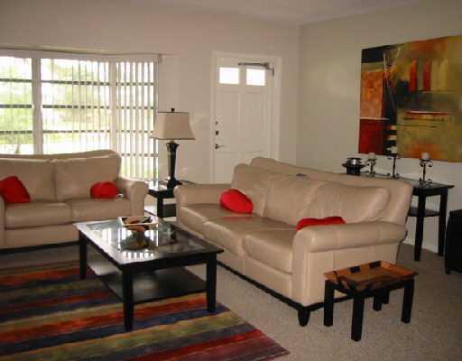 1249 Southwest 12th Avenue Boca Raton, FL 33486 - Photo 6 of 8 a living room with furniture and a window