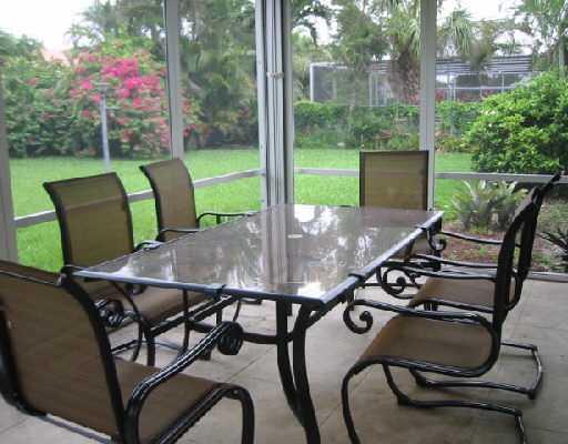 1249 Southwest 12th Avenue Boca Raton, FL 33486 - Photo 7 of 8 a view of a chairs and table in patio
