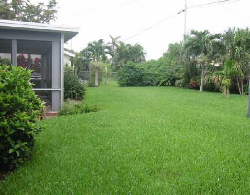1249 Southwest 12th Avenue Boca Raton, FL 33486 - Photo 8 of 8 a view of a house with backyard