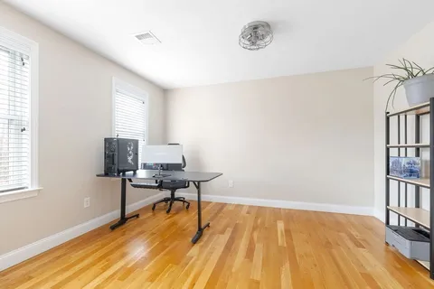 a workspace with wooden floor