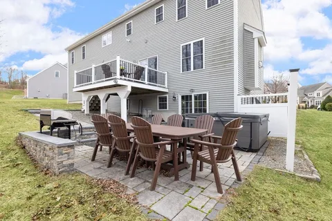 a view of a patio with table and chairs