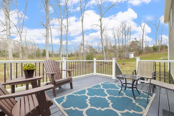 a view of a chairs on roof deck