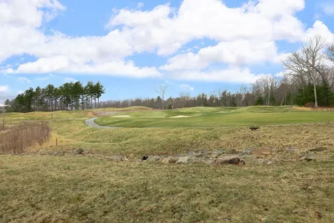 a view of a lake with a big yard
