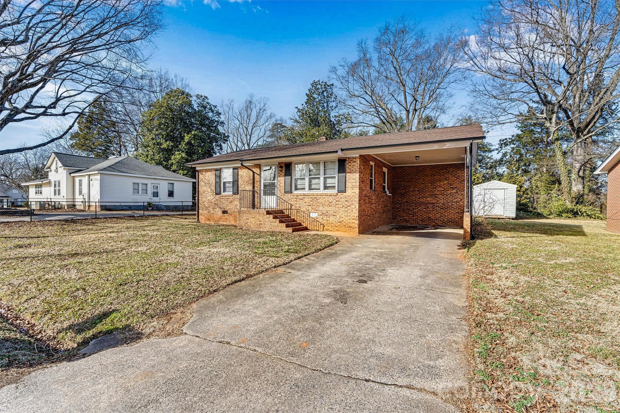 105 9th Street Southeast Conover, NC 28613 - Photo 1 of 9 a view of a house with a yard covered in snow