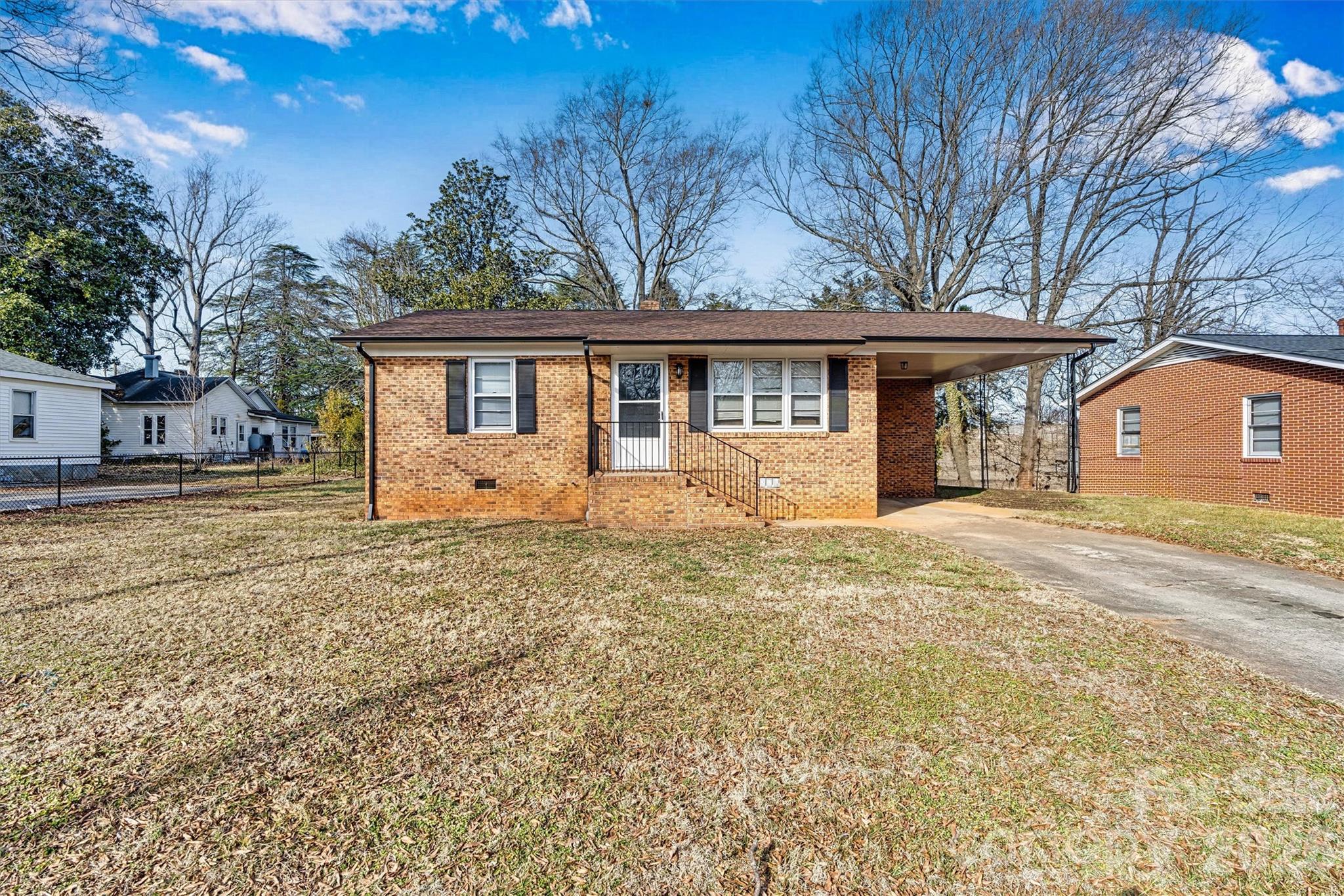 105 9th Street Southeast Conover, NC 28613 - Photo 2 of 9 a front view of a house with a garden