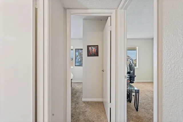 a view of a bathroom from a hallway