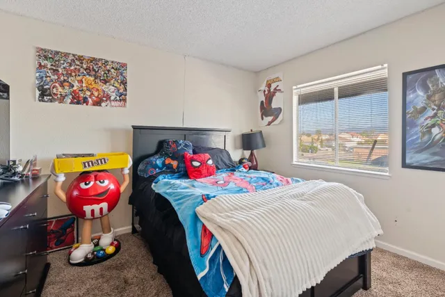 a bedroom with bed and a window