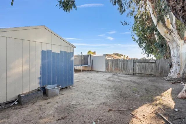 a view of backyard with a patio