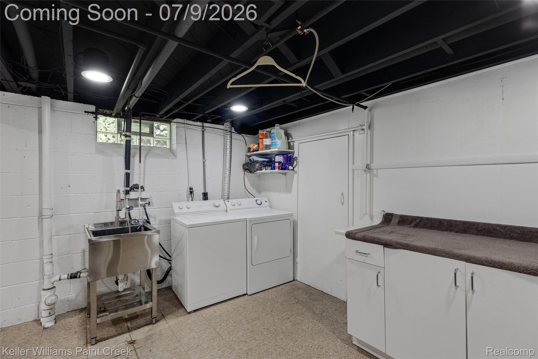 2731 Crooks Road Royal Oak, MI 48073 - Photo 20 of 34 Dedicated utility area featuring a stainless steel utility sink, washer and dryer appliances, block walls, recessed lighting, and a painted exposed ceiling