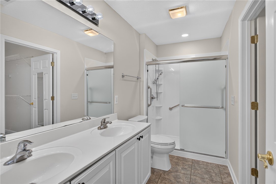 134 Life Style Lane Anderson, SC 29621 - Photo 23 of 44 A pristine full bathroom with a dual vanity, shower, and easy-care tile flooring.