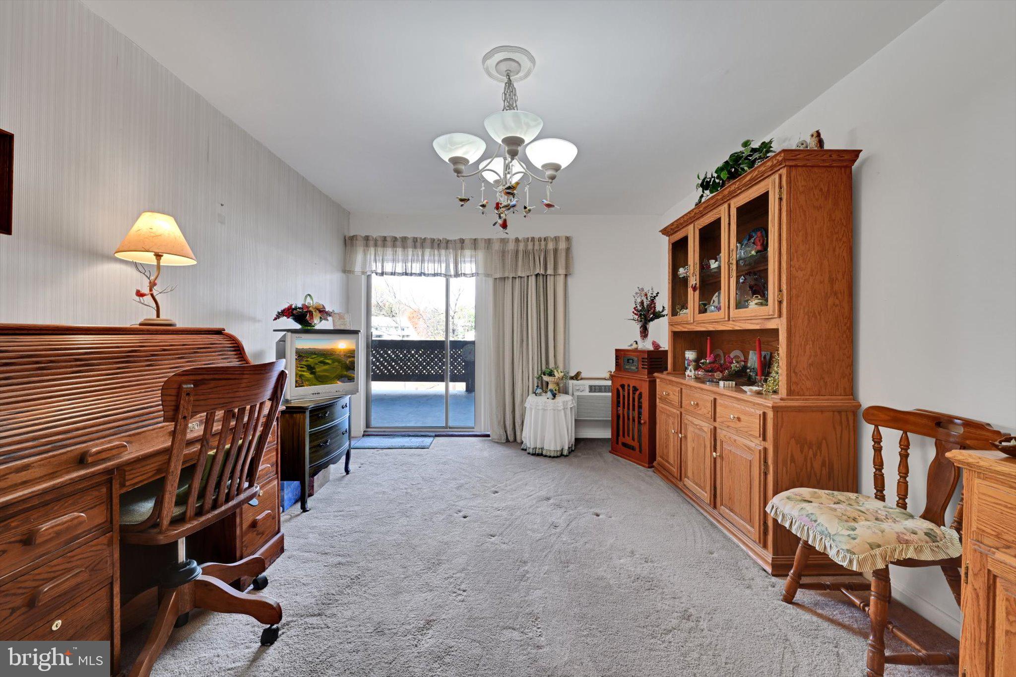 1334 West Wyomissing Court, Unit Q West Lawn, PA 19609 - Photo 11 of 25 a view of a dining room with furniture and chandelier