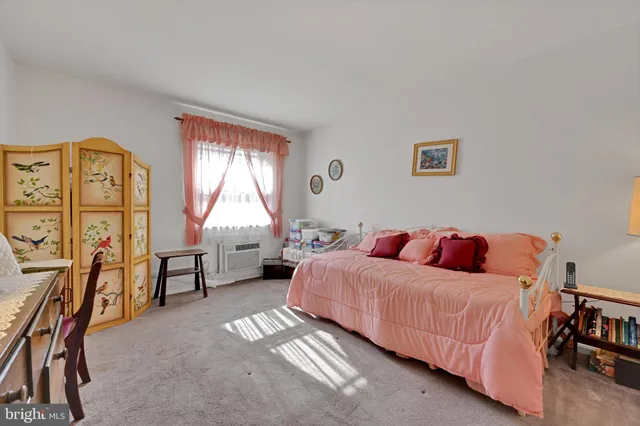 a bedroom with a bed and furniture