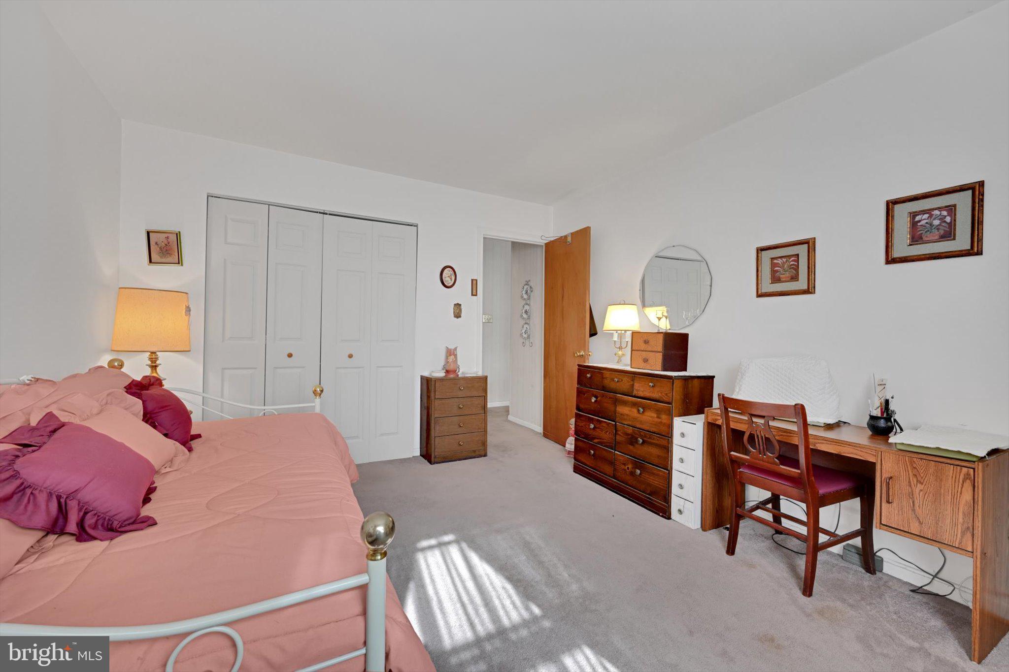 1334 West Wyomissing Court, Unit Q West Lawn, PA 19609 - Photo 14 of 25 a bedroom with a bed and furniture