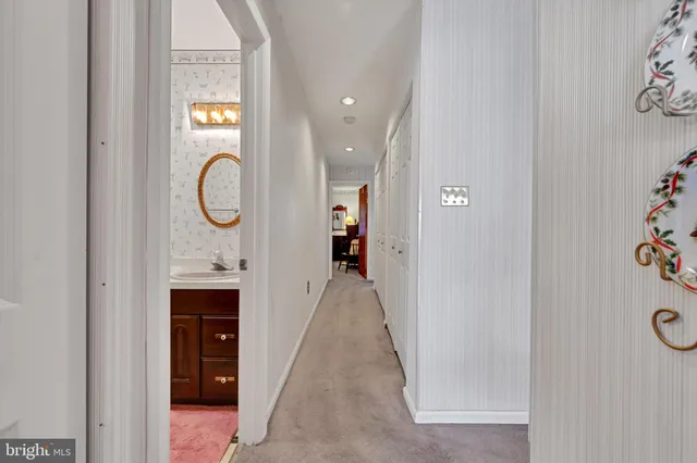 a view of a hallway with white walls