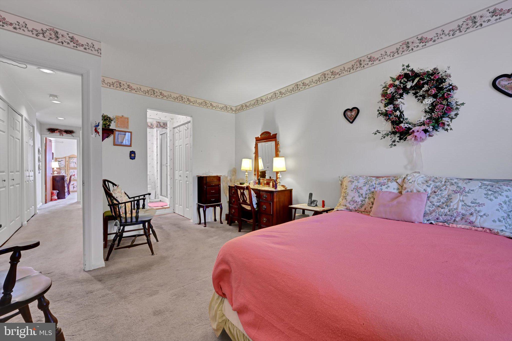 1334 West Wyomissing Court, Unit Q West Lawn, PA 19609 - Photo 19 of 25 a bedroom with a bed and a table