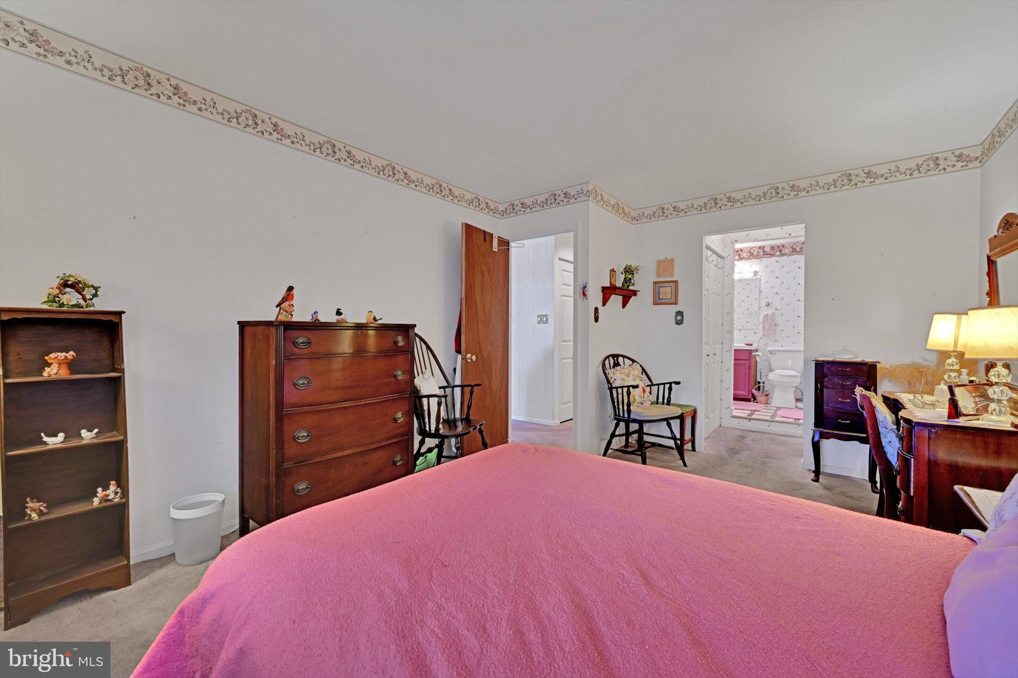 1334 West Wyomissing Court, Unit Q West Lawn, PA 19609 - Photo 20 of 25 a bed room with a bed and dresser