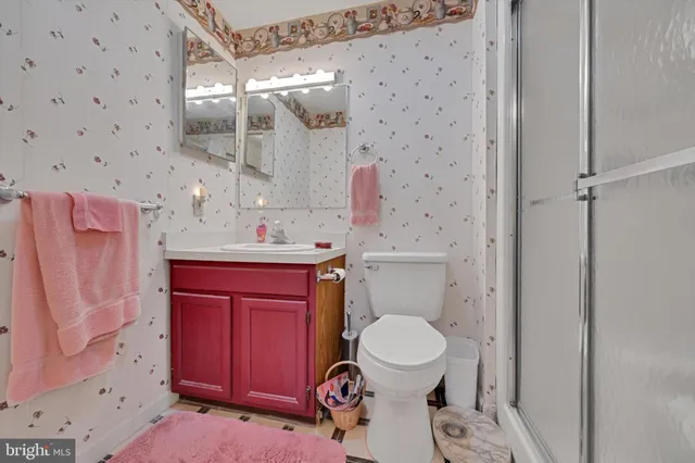 a view of a hallway with washer and dryer