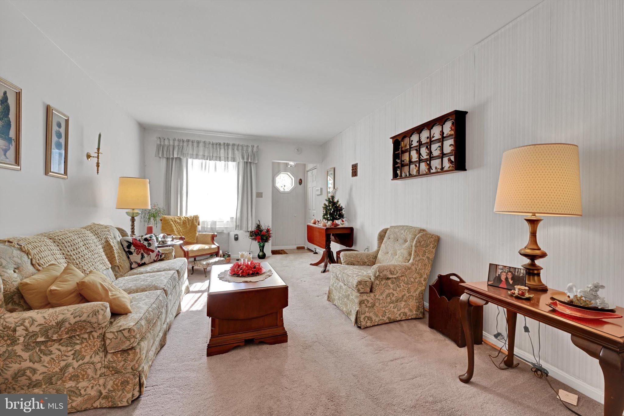1334 West Wyomissing Court, Unit Q West Lawn, PA 19609 - Photo 4 of 25 a living room with furniture a lamp and a window