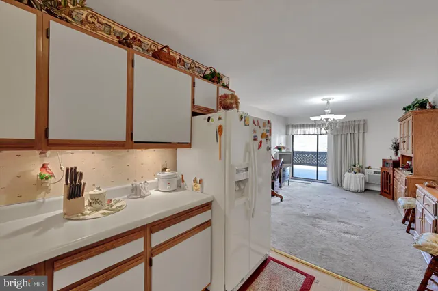 a view of a kitchen with furniture and a window