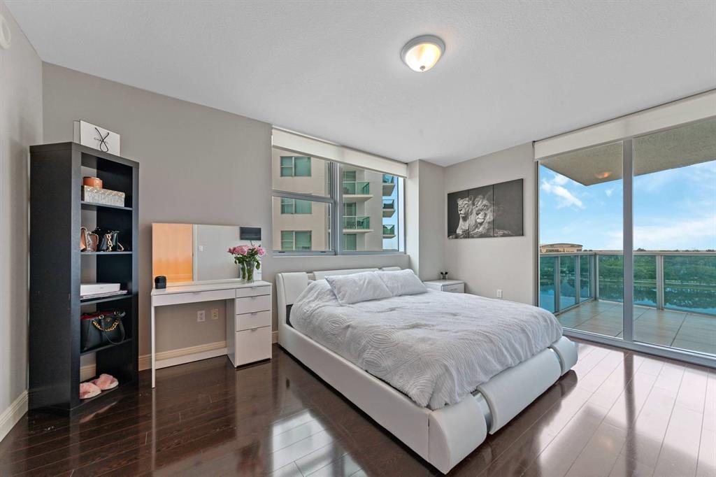 2641 North Flamingo Road Fort Lauderdale, FL 33323 - Photo 17 of 26 a bedroom with a large bed and a large window