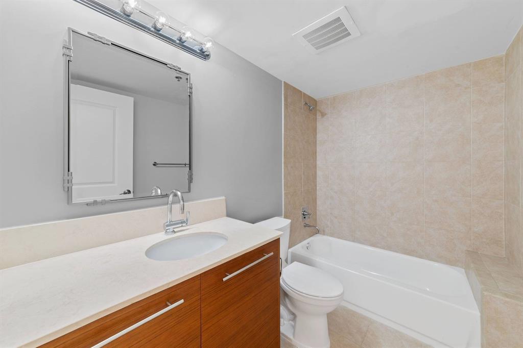 2641 North Flamingo Road Fort Lauderdale, FL 33323 - Photo 23 of 26 a bathroom with a sink a toilet and shower