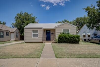 2320 26th Street Lubbock, TX 79411 - Photo 1 of 17 a front view of a house with yard
